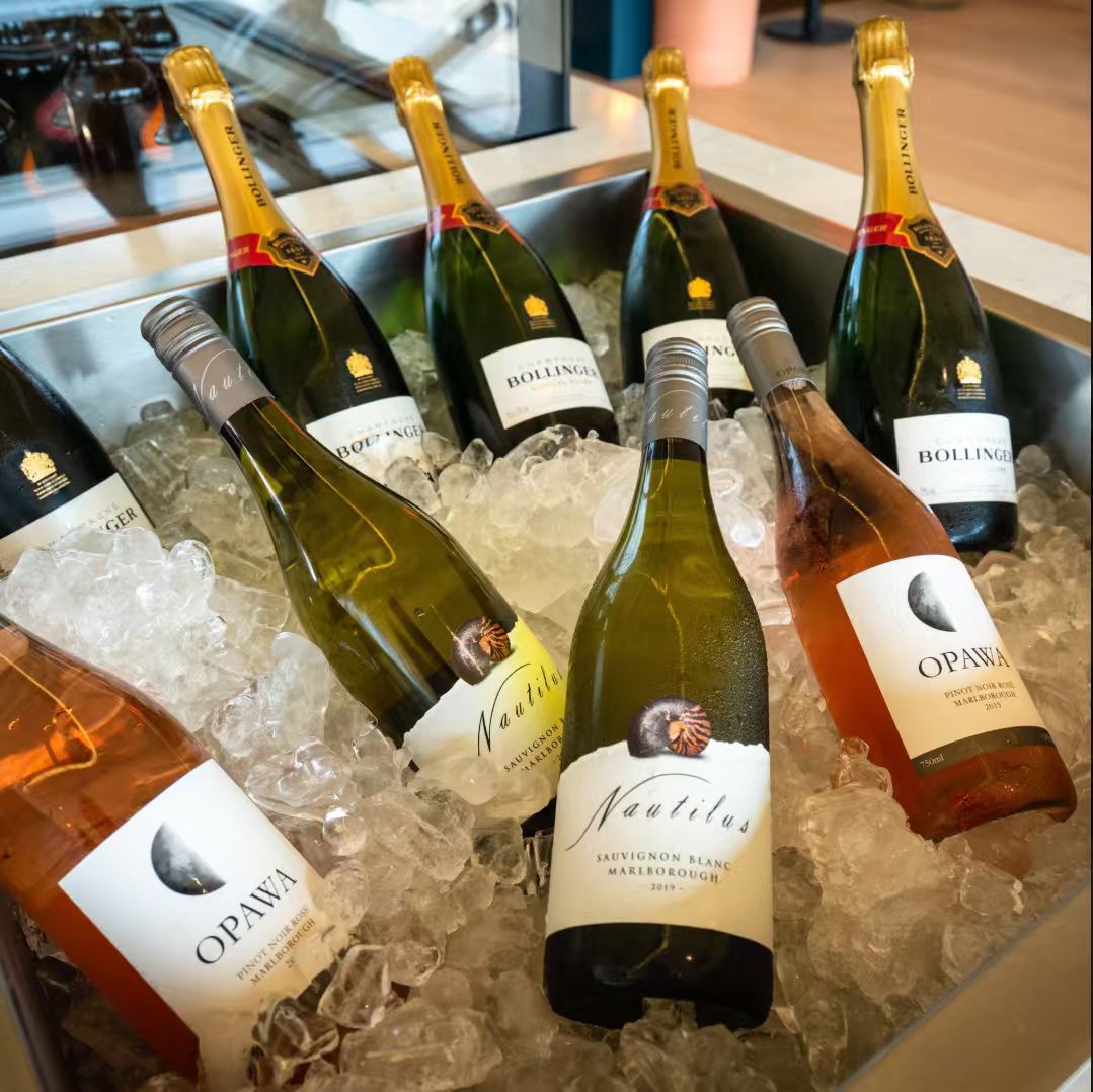 Wine and champagne bottles chilled on ice at Fields